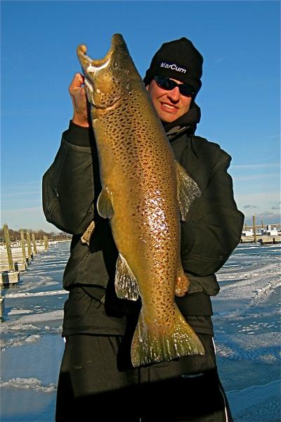 Ice fishing for trout in Lake Michigan harbors